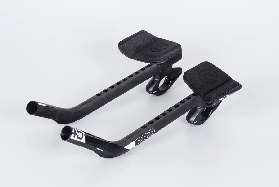 PRO Missile EVO carbon ski-bend clip-on aerobar with weight-reduction holes along the extension, shown on a white background
