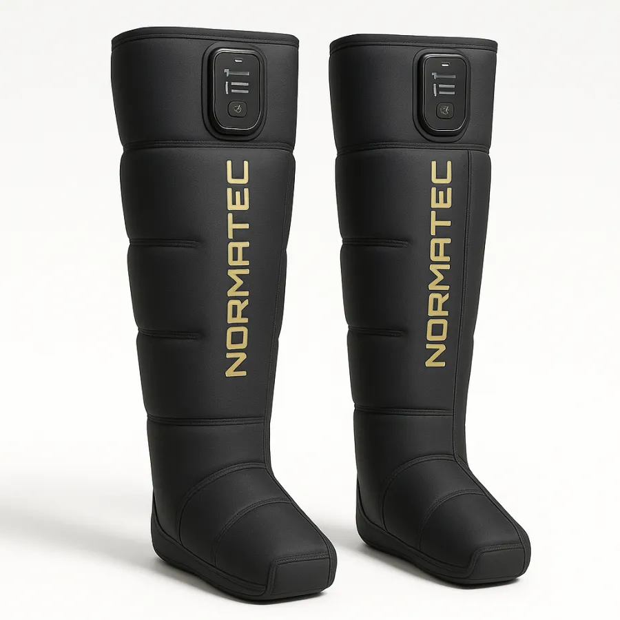 Hyperice Normatec Elite wireless compression boots in dark grey with integrated controls, on a gym floor