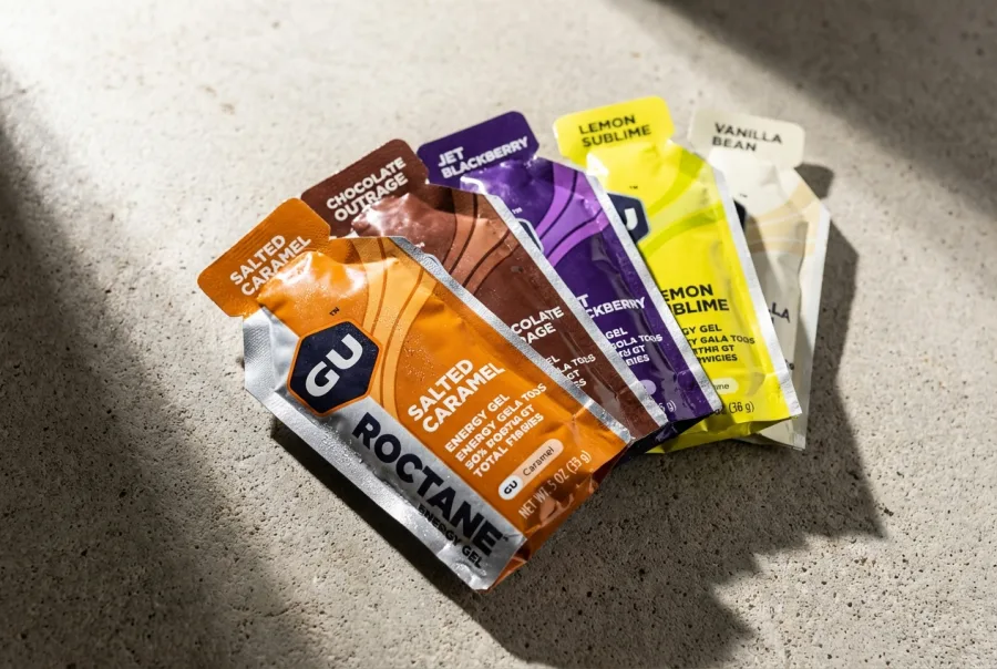 GU Energy Gel packets — photorealistic product shot