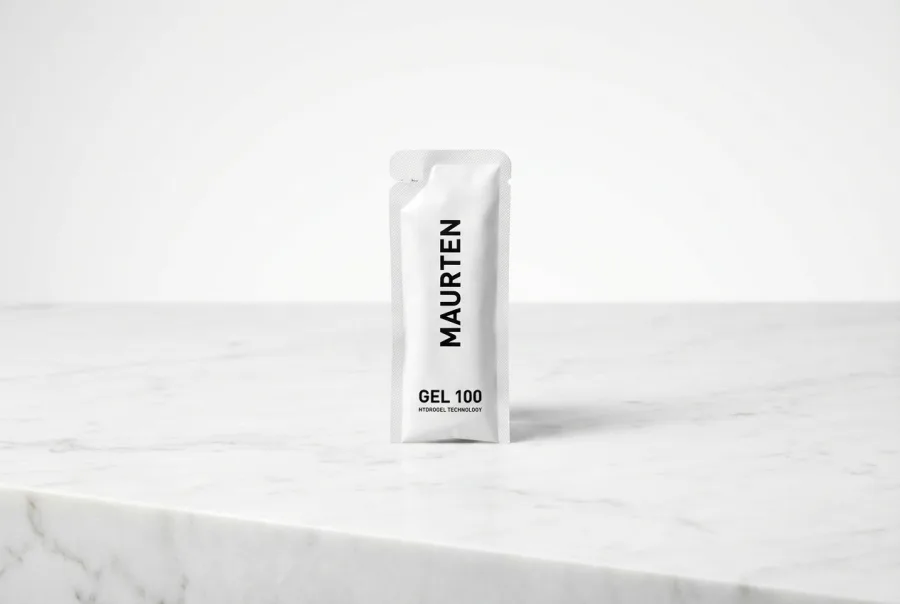 Maurten Gel 100 — minimalist white packaging, premium sports science product shot