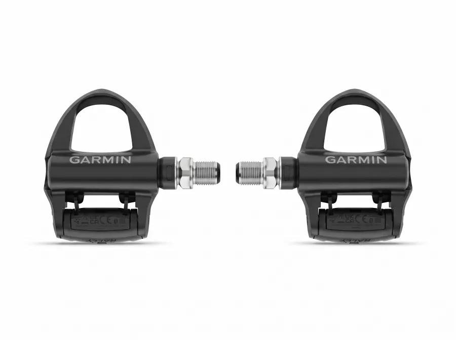 A pair of Garmin Rally RS210 power meter pedals shown facing each other, both displaying the Garmin logo, on a white studio background