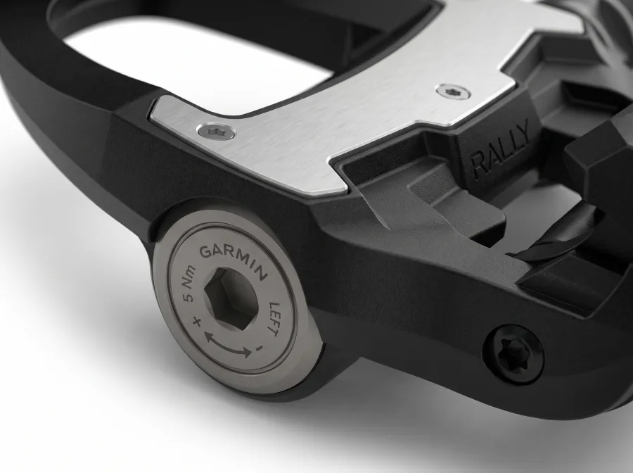 Close-up of the Garmin Rally RS210 pedal spindle and cleat area, showing the SPD-SL cleat attachment points and sensor housing