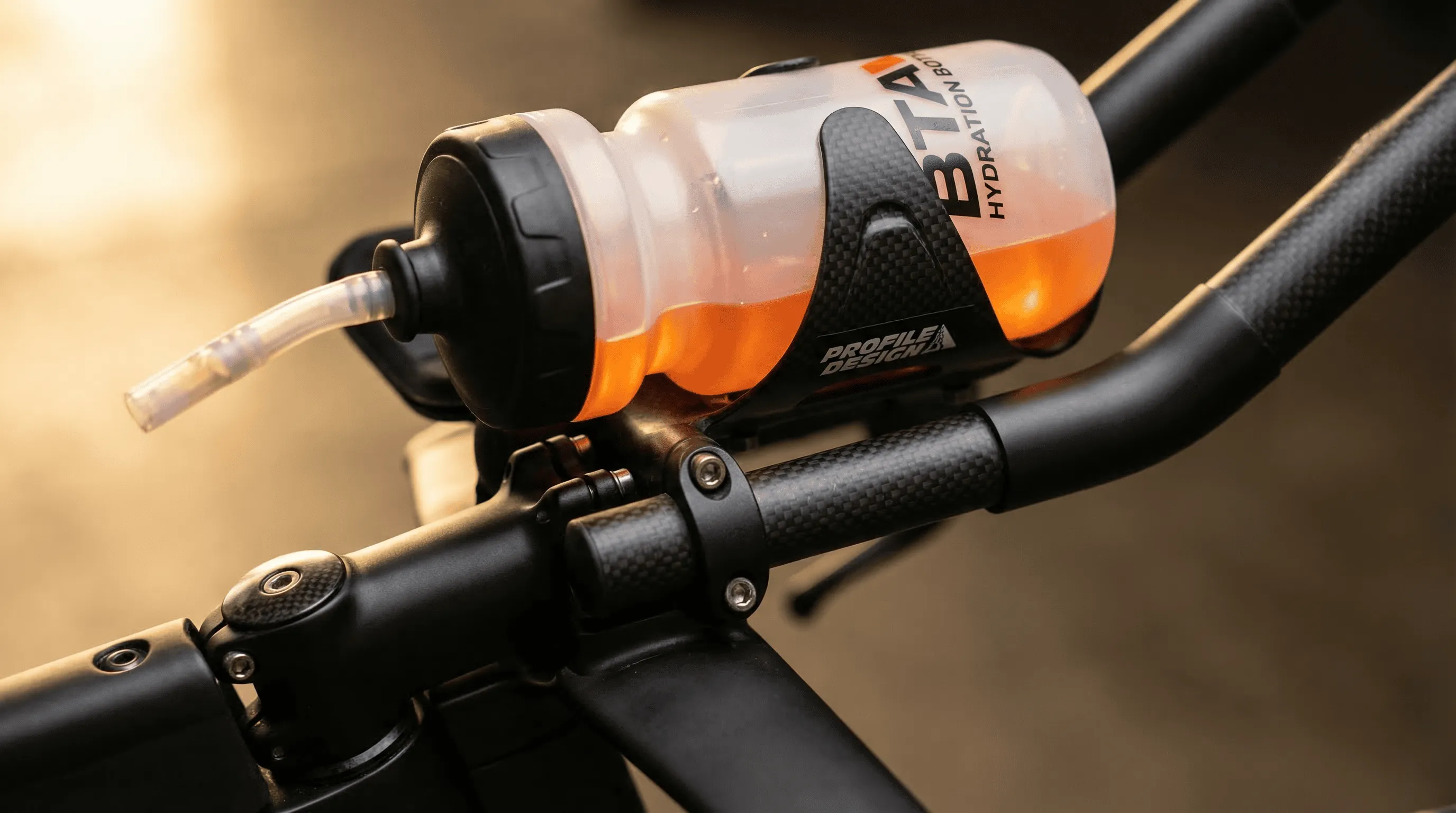 Close-up macro shot of a BTA between-the-arms hydration bottle mounted on a TT bike cockpit