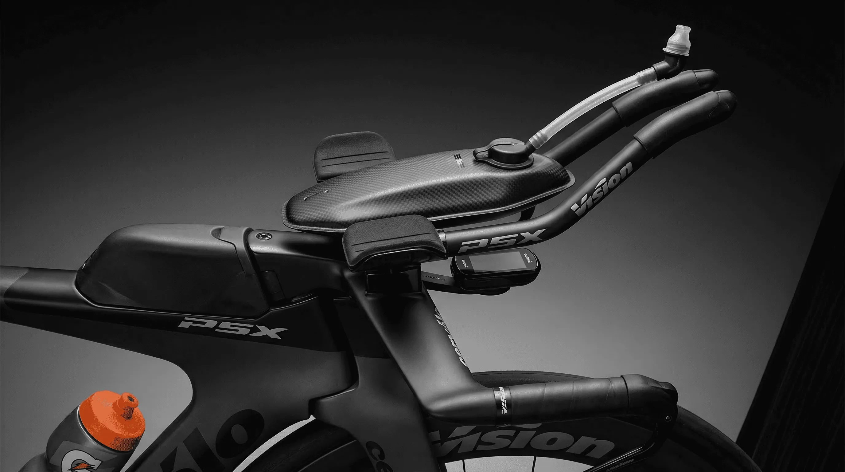 Integrated aero hydration system built into a high-end time trial bike cockpit with drinking straw