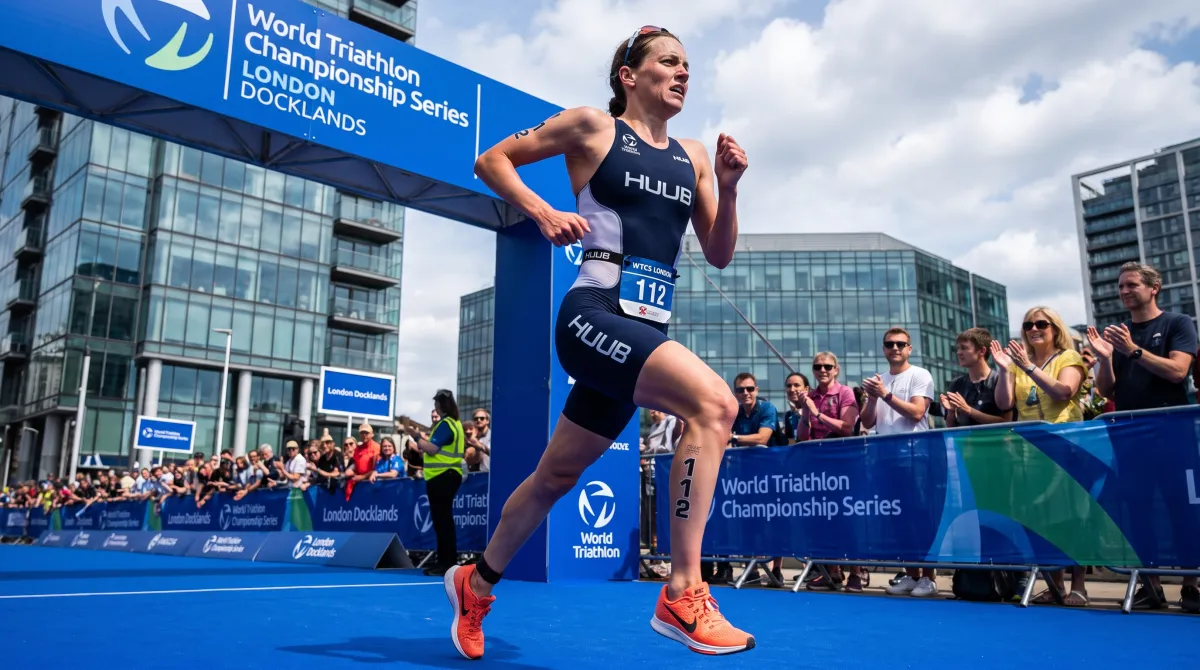 Elite triathlete sprinting down the blue finish carpet at a World Triathlon Championship Series race